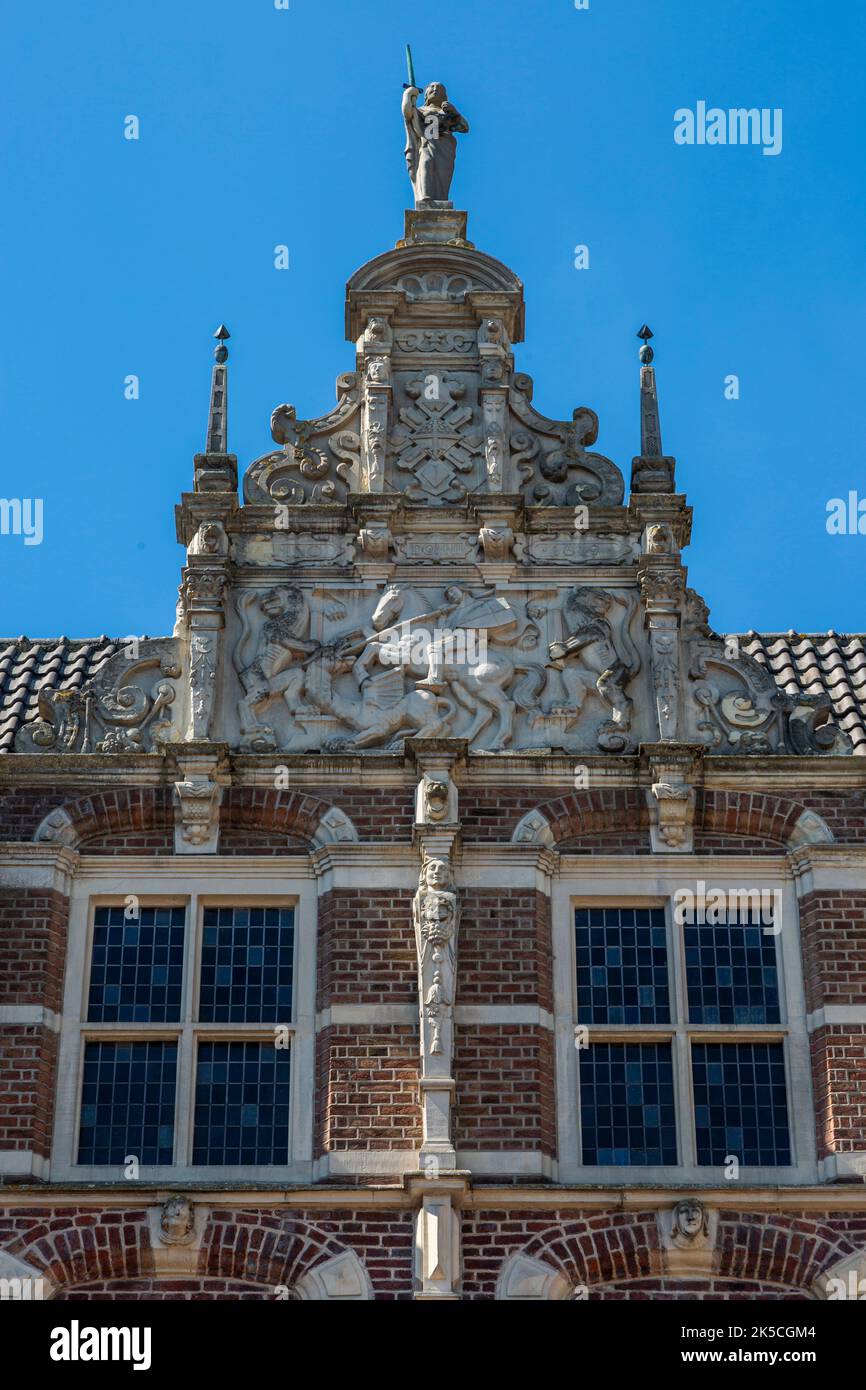 Germany, Bocholt, Lower Rhine, Westmuensterland, Muensterland, Westphalia, North Rhine-Westphalia, NRW, Historic Town Hall Bocholt, Renaissance, partial view, dwarf gable depicting city patron Saint George fighting with dragon Stock Photo