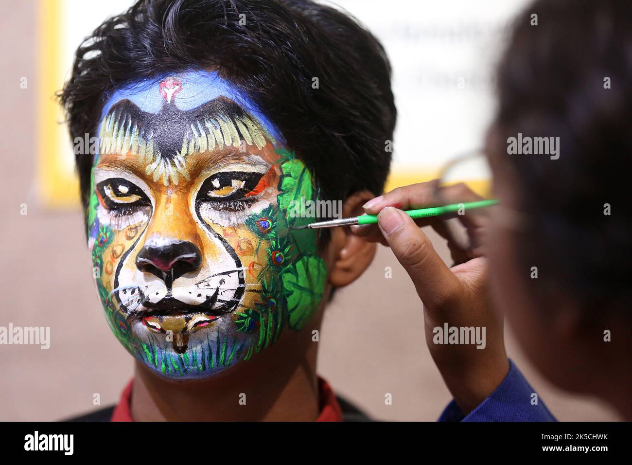 A student has her face painted during a face painting competition in the  western Indian city of Ahmedabad January 22, 2011. REUTERS/Amit Dave (INDIA  - Tags: SOCIETY Stock Photo - Alamy