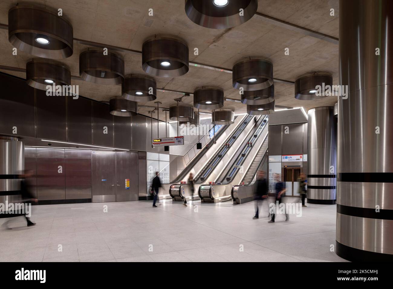 Wide view of circulation and escalator showing lighting drums