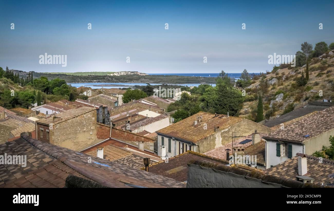 Roofs of Fitou and view of the Mediterranean Sea. Stock Photo