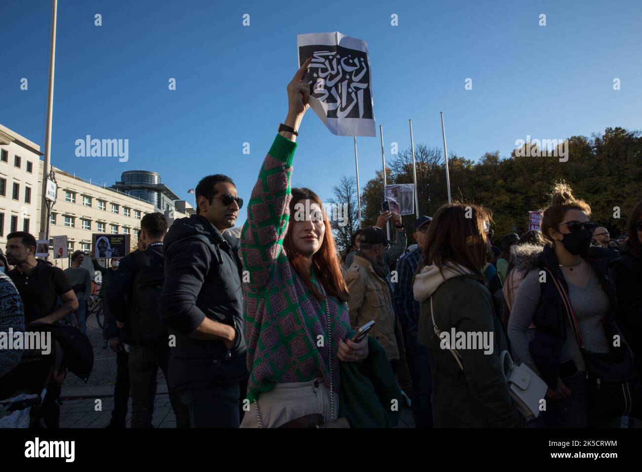 Berlin, Germany. 7th Oct, 2022. Protesters gathered at the Brandenburg Gate in Berlin on October 7, 2022, in solidarity with the protests in Iran. The protesters protested against the Mullah regime in Iran and expressed their sadness about the death of Mahsa Amini. The protesters also took to the streets against state violence and insufficient women's rights in Iran. (Credit Image: © Michael Kuenne/PRESSCOV via ZUMA Press Wire) Stock Photo