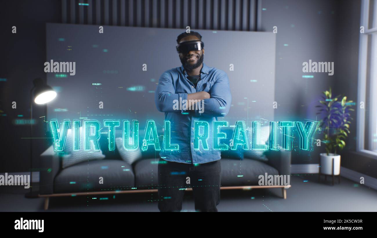 A young black man uses virtual reality glasses and immerses himself in the virtual world. New technologies. Entertainment of the future Stock Photo
