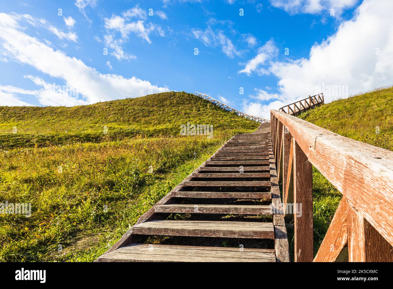 Wooden stairs going up to the historical mound of Seredzius, Lithuania Stock Photo