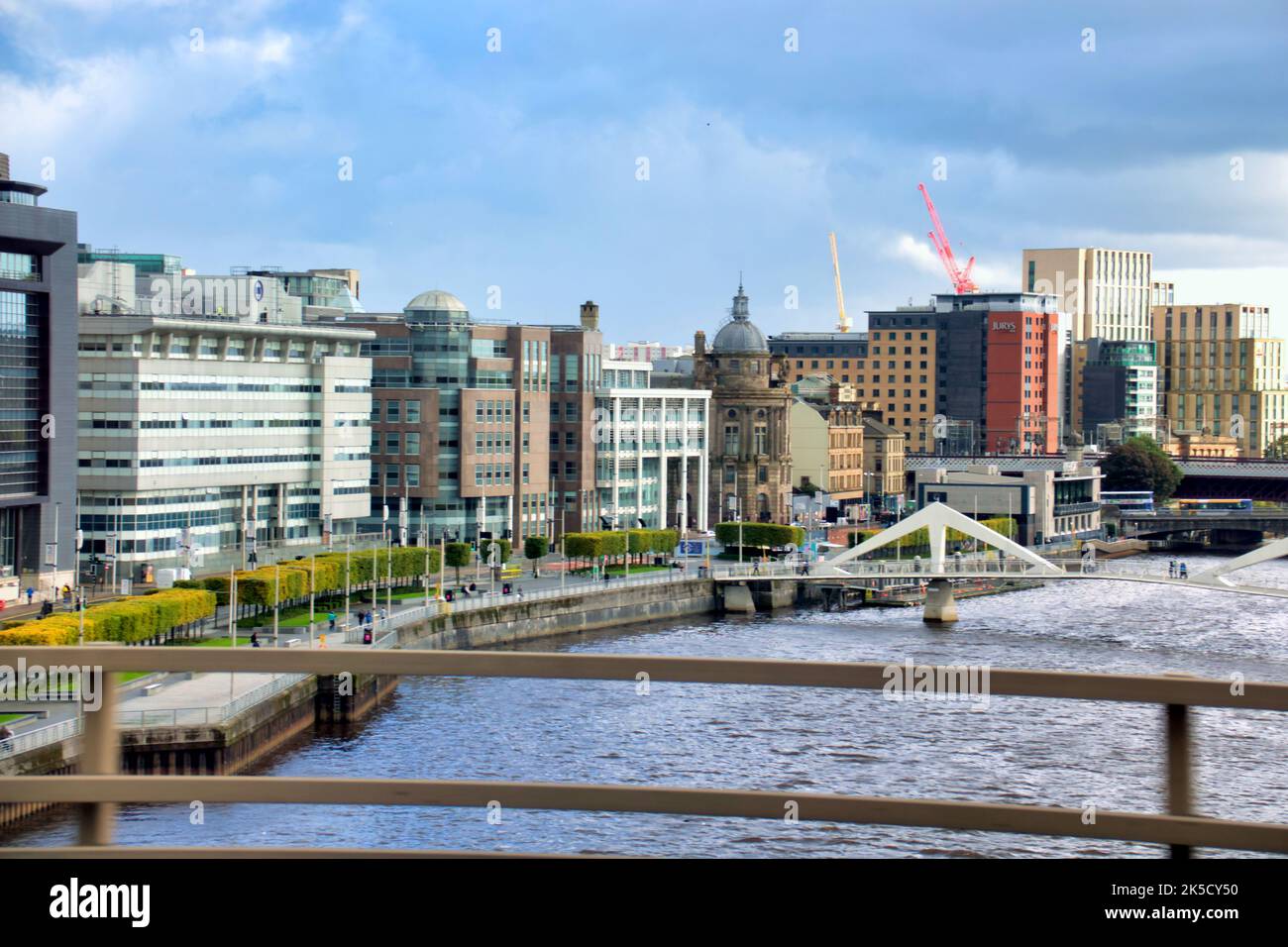 Aerial view of glasgow from the kingston bridge showing the clyde river with the squiggly bridge and the town centre waterfront with the clyde walkway Stock Photo