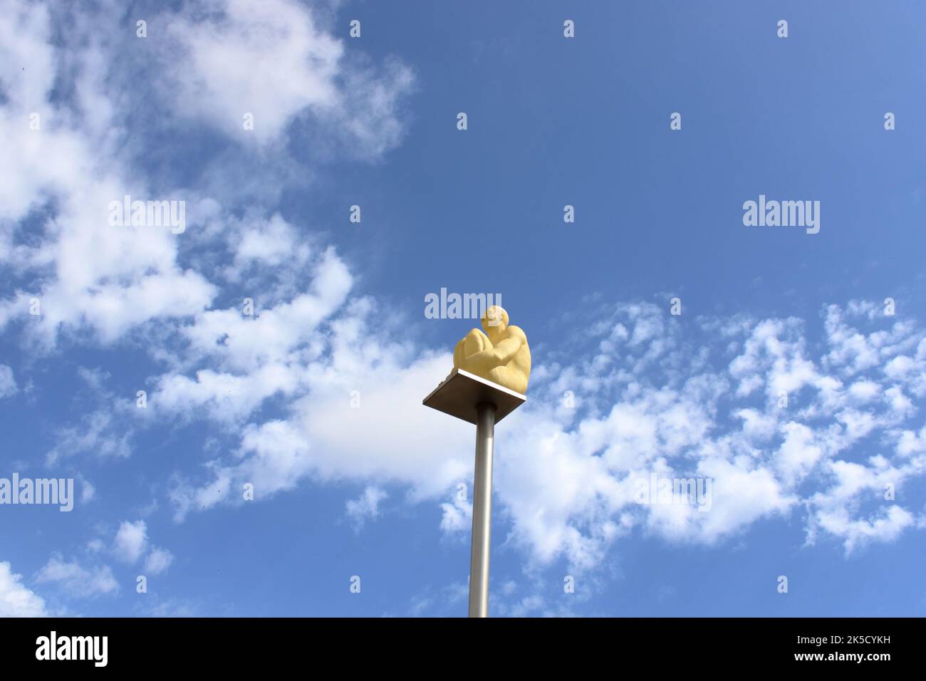 View of part of the sitting man art installation by the spanish artist