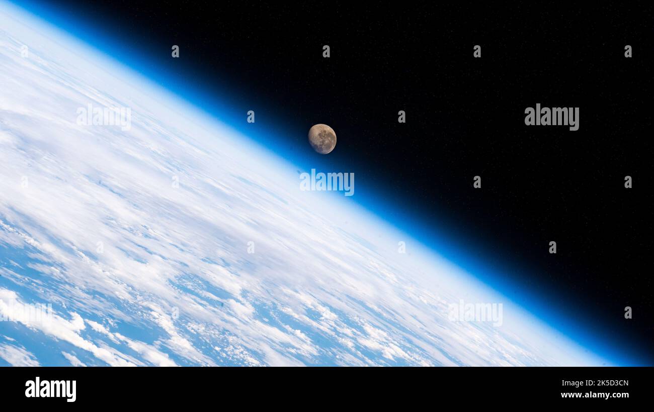 The waning gibbous Moon is pictured above the Earth's horizon as the International Space Station orbited 272 miles above the Atlantic Ocean in betweenthe tips of South America and South Africa. Stock Photo