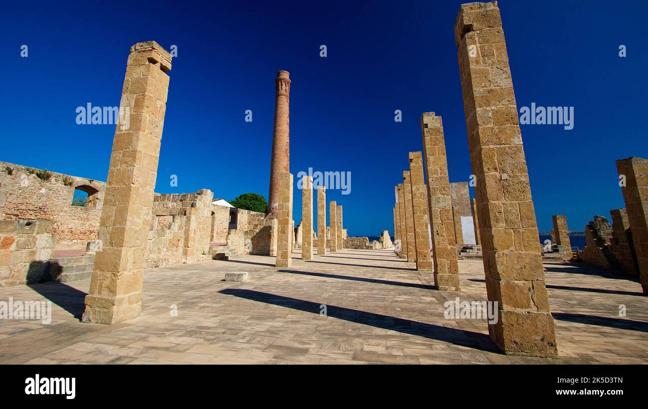 Italy, Sicily, east coast, bird sanctuary Vendicari, ruins of a tonnara, tuna processing factory, stone columns, stone floor, deep blue sky, wide angle shot Stock Photo