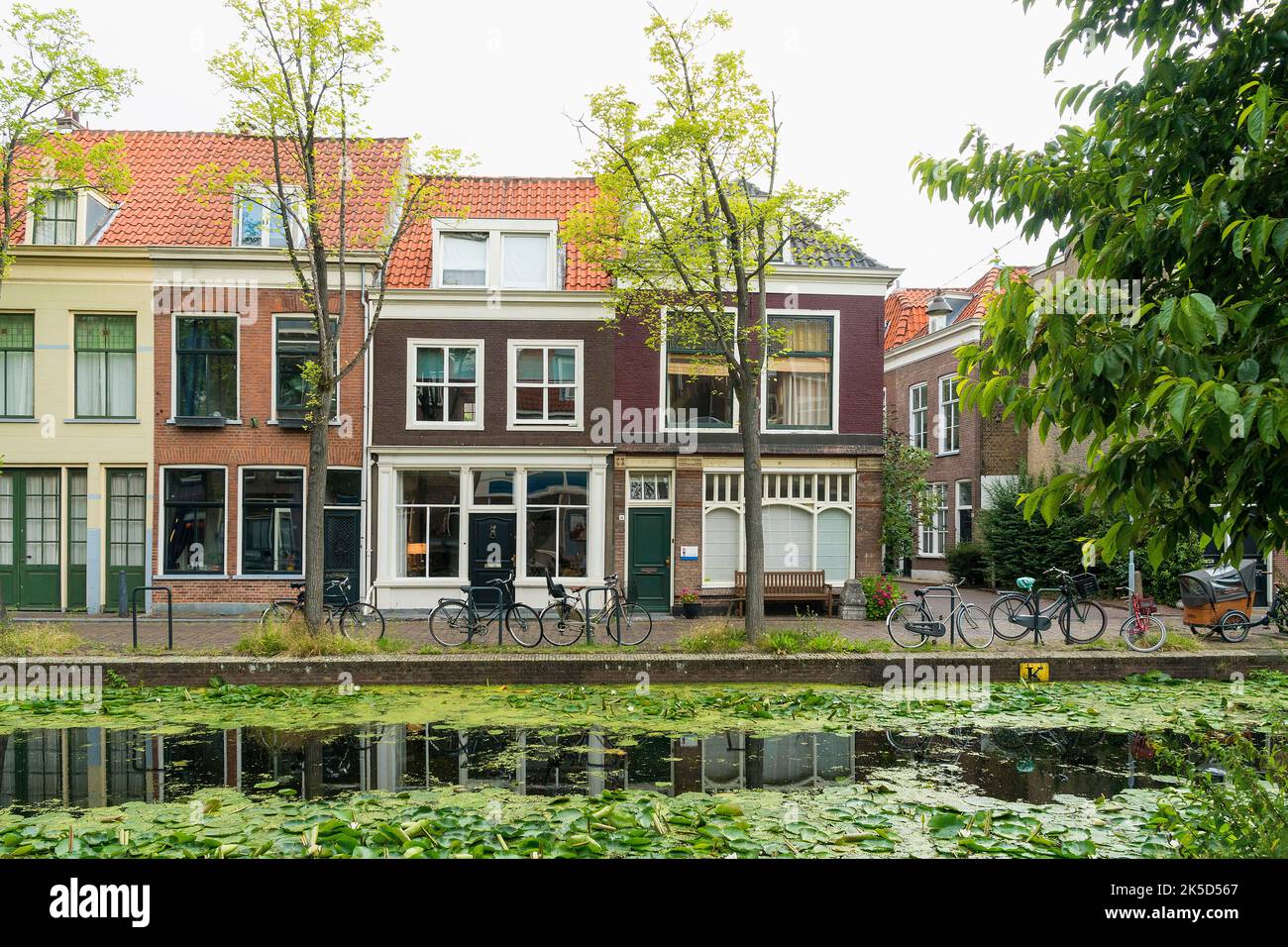 Delft (Netherlands), historical old town, achterom, canal, residential houses Stock Photo