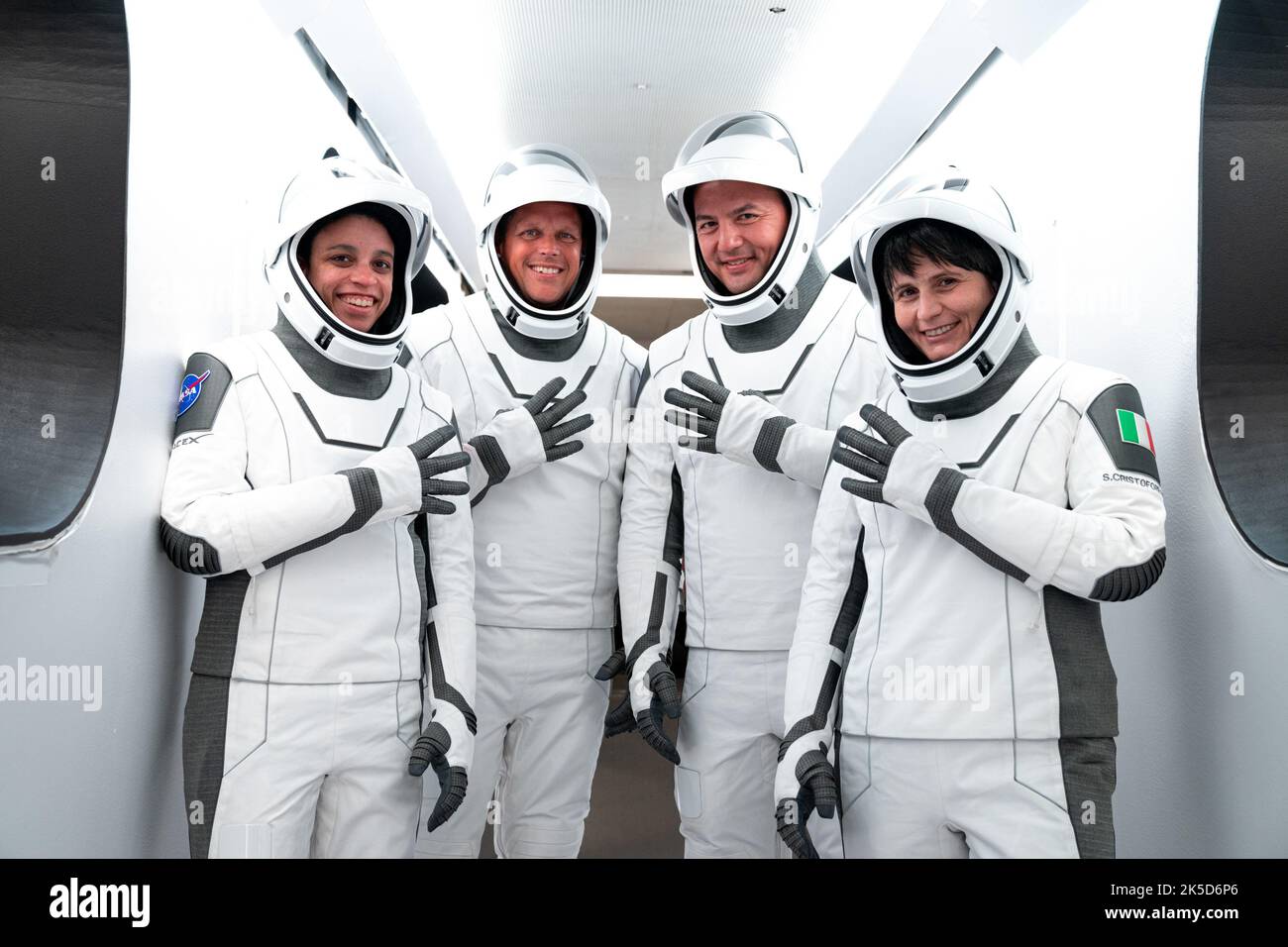 Crew-4 astronauts, from left, Jessica Watson, mission specialist; Bob Hines, pilot; Kjell Lindgren, commander and Samantha Cristoforetti, mission specialist, pose outside SpaceX’s Crew Dragon, named Freedom by the Crew-4 crew, during a dry dress rehearsal at Kennedy Space Center in Florida on April 20, 2022. Crew-4 will launch the astronauts to the International Space Station as part of NASA’s Commercial Crew Program. Liftoff is targeted for 5:26 a.m. EDT on Saturday, April 23, 2022, from Launch Complex 39A at Kennedy. Stock Photo
