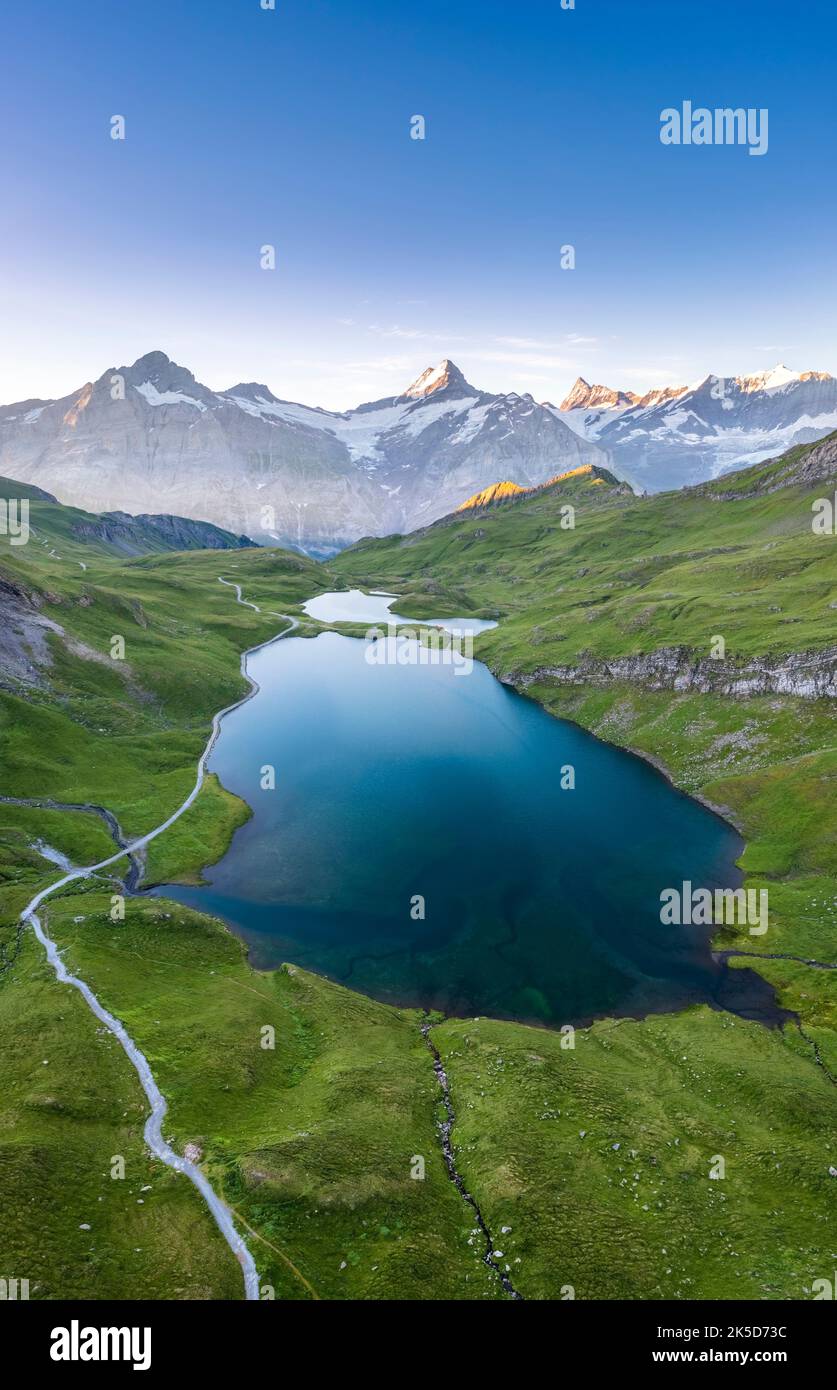 Aerial view of the Bachalpsee lake during a summer sunrise. Grindelwald, Canton of Bern, Switzerland, Europe. Stock Photo