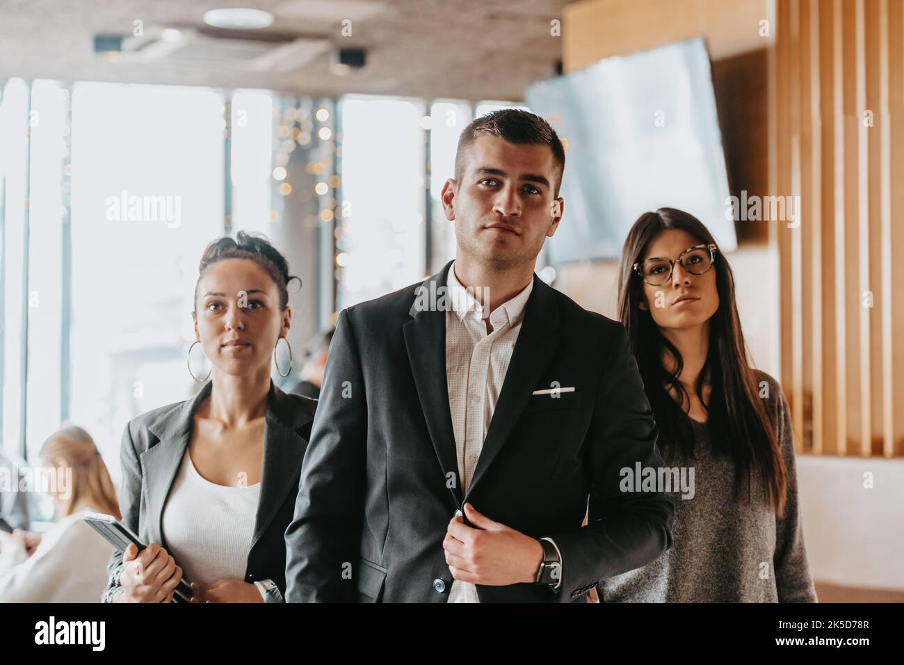 Group of successful business people standing together at office Stock ...