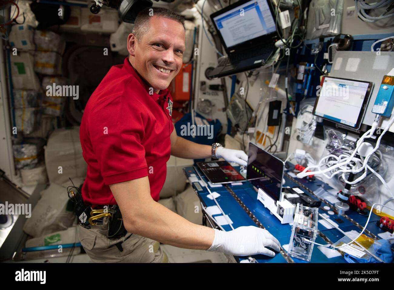 NASA astronaut Bob Hines is shown performing Genes in Space-9 aboard the International Space Station (ISS). Cell-free technology is a platform for protein production that does not include living cells. GIS-9 evaluates two approaches for using this technology in microgravity: cell-free protein production and biosensors that can detect specific target molecules. The technology could provide a portable, low-resource, and low-cost tool with potential applications for medical diagnostics, on-demand production of medicine and vaccines, and environmental monitoring on future space missions. Stock Photo