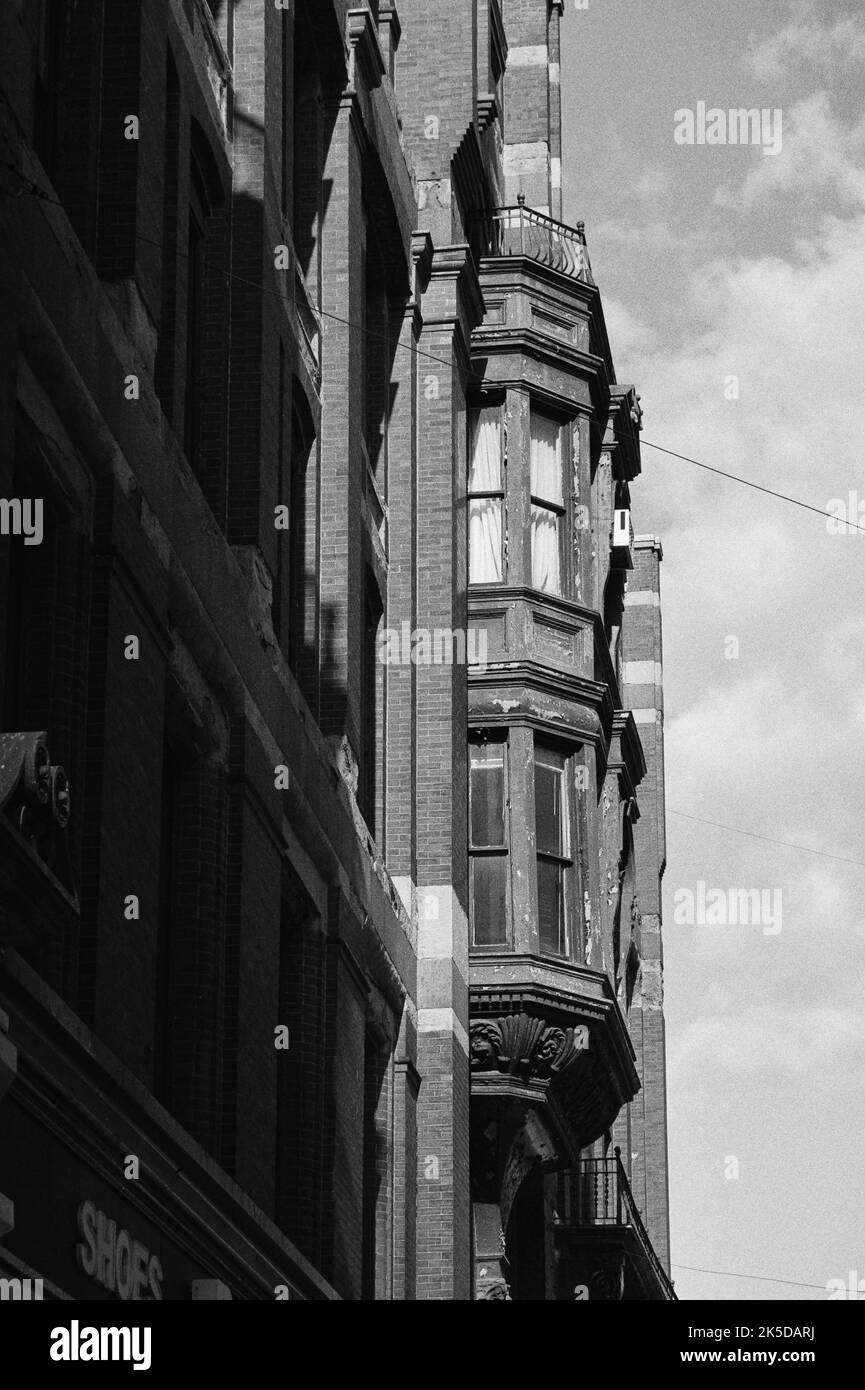 Beautiful yet weathered Victorian building line the street in historic