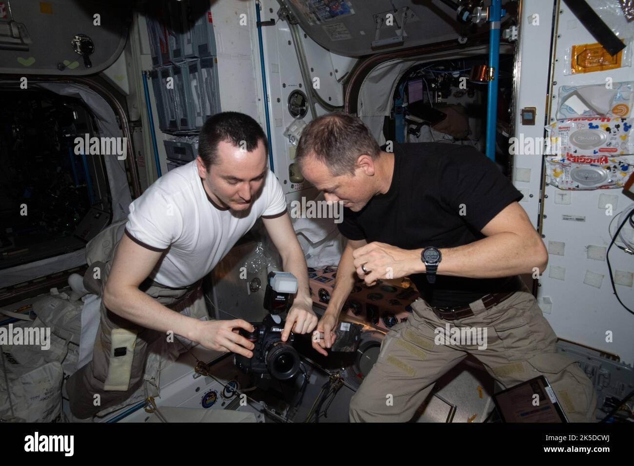 Iss Unity Module 360 Expedition 66 engineers Pyotr Dubrov and Tom Marshburn examine ...