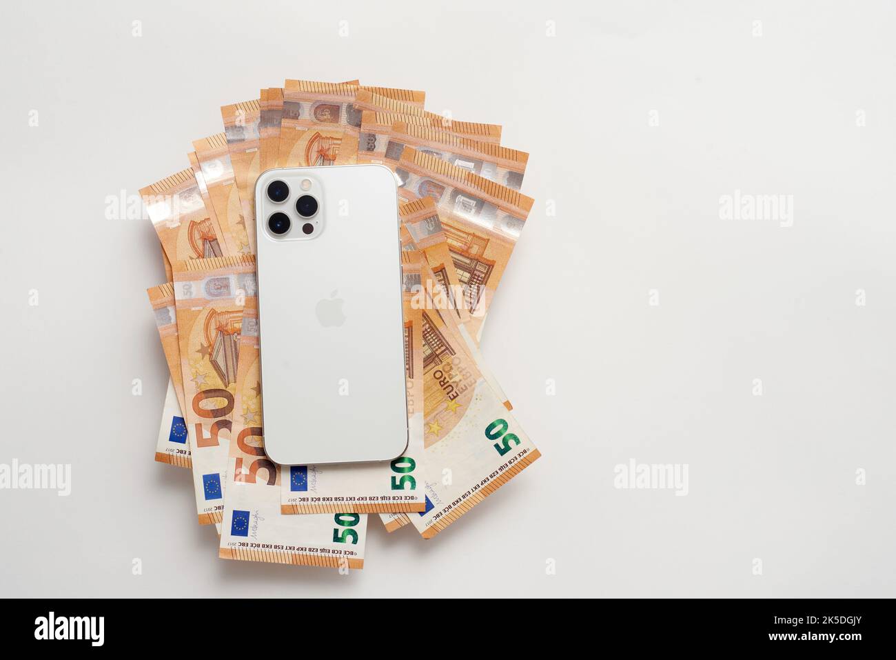 New white iPhone on Euro bills Stock Photo
