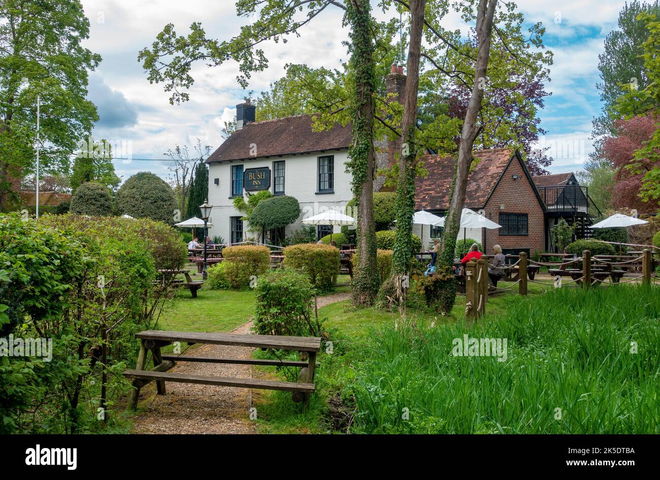 The Bush Inn pub nestled in the South Downs National Park, beside the river Itchen in Ovington near New Alresford in Hampshire, England, UK Stock Photo