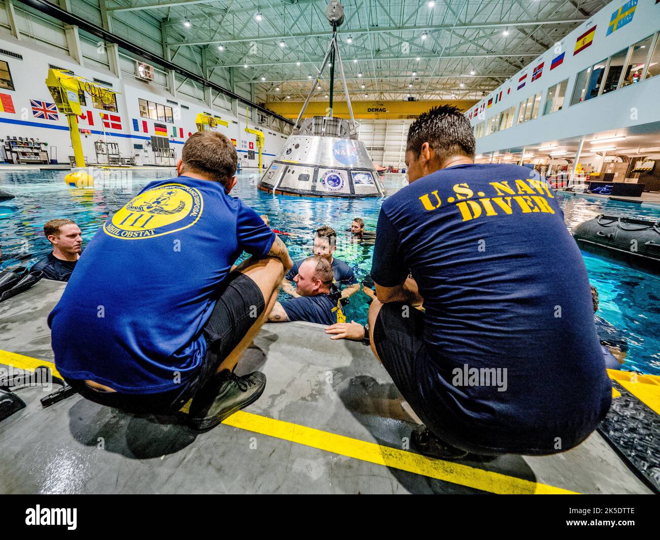 A group of U.S. Navy divers, Air Force pararescumen and Coast Guard