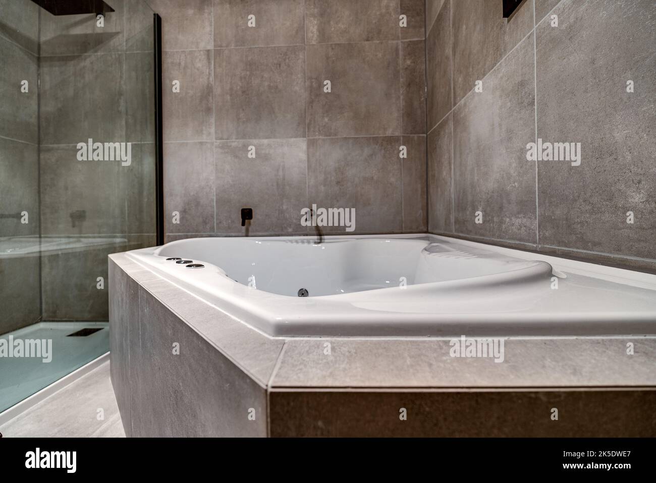 A modern bathroom renovation and makeover with jacuzzi, and shower, for ...