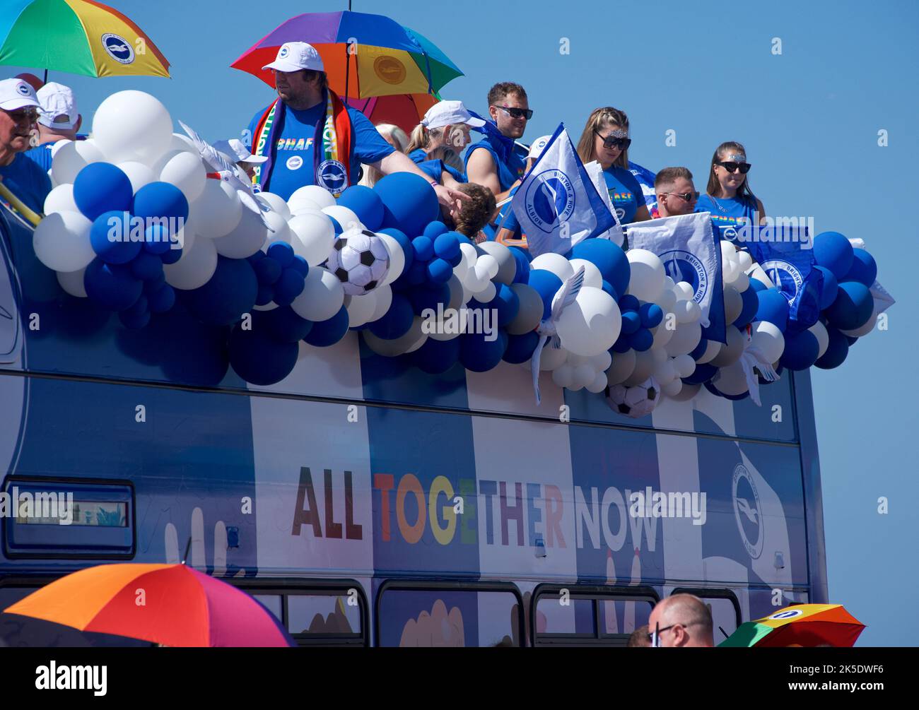 Brighton & Hove Pride Festival, Brighton & Hove, East Sussex, England. Brighton & Hove Albion Football Club's official Pride 'float' on board an open double-decker bus, decorated in team colours. Stock Photo