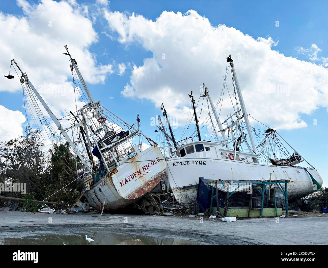 Fort Myers Beach, United States. 04th Oct, 2022. Shrimp trawlers tossed into a pile on land destroyed by the massive Category 4 Hurricane Ian, October 4, 2022 in Fort Myers Beach, Florida. Credit: Mark Rankin/US Army/Alamy Live News Stock Photo