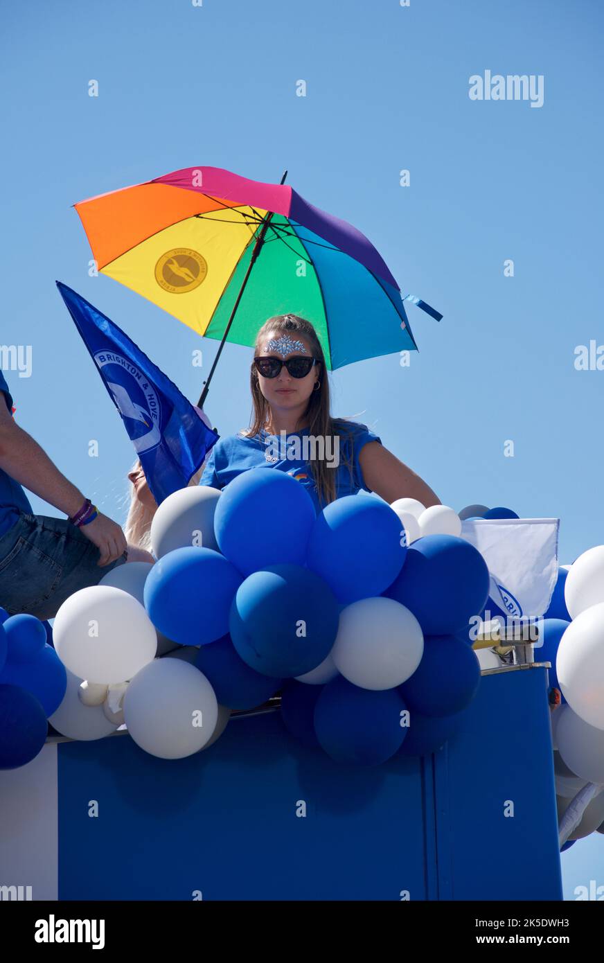 Brighton & Hove Pride Festival, Brighton & Hove, East Sussex, England. On the top deck of Brighton & Hove Albion Football Club's official Pride 'float', decorated in team colours. Stock Photo