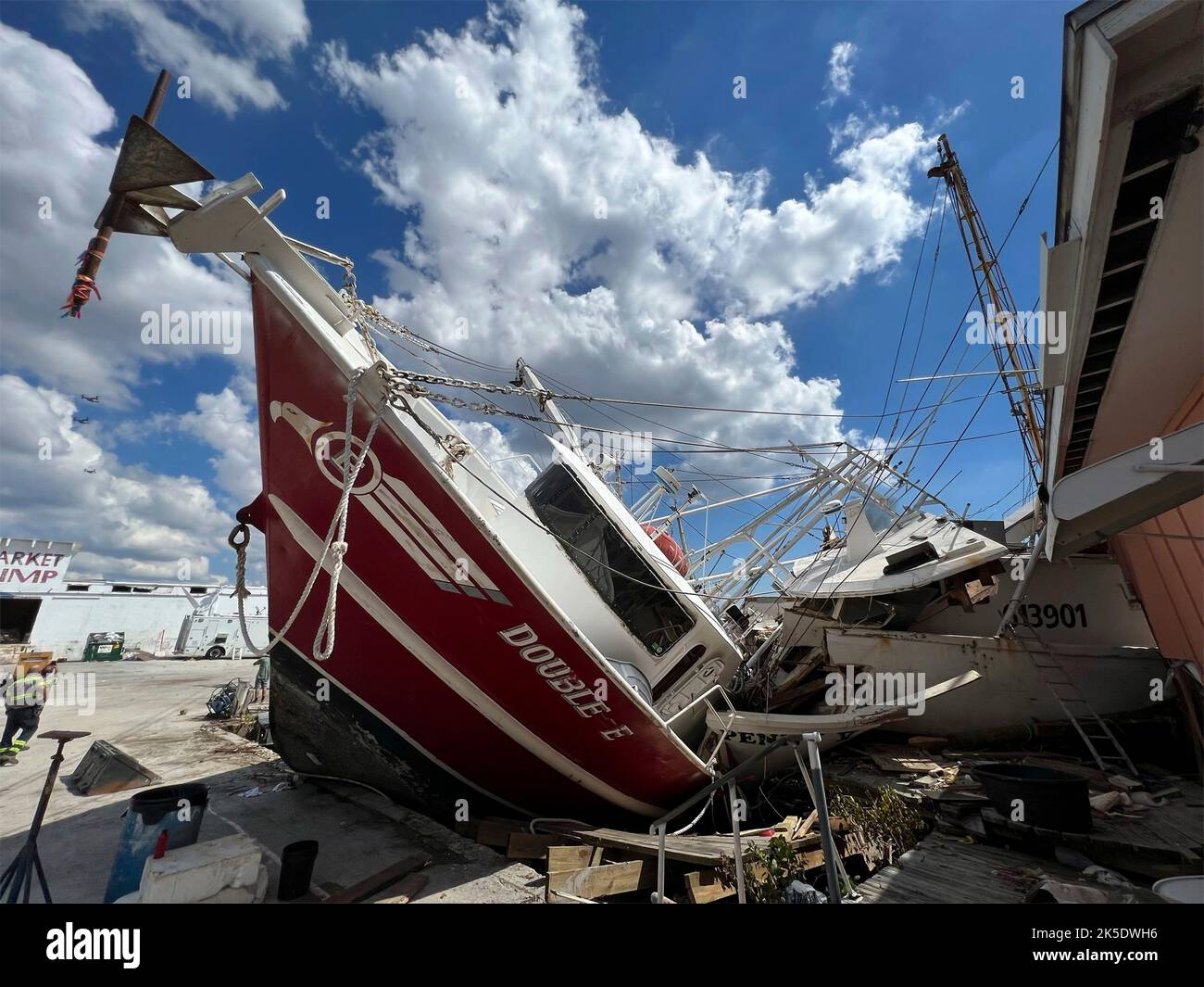 Fort Myers Beach, United States. 04th Oct, 2022. Shrimp trawlers tossed into a pile on land destroyed by the massive Category 4 Hurricane Ian, October 4, 2022 in Fort Myers Beach, Florida. Credit: Mark Rankin/US Army/Alamy Live News Stock Photo