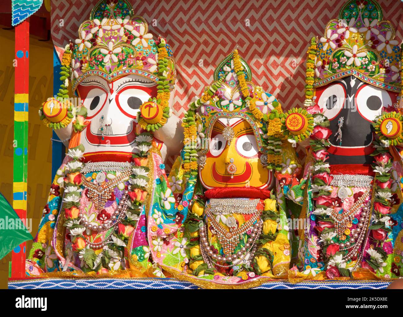 Detail of the Hare Krishna procession juggernaut, with deities adorned. The annual Rathayatra Festival for Lord Krishna and his devotees promenades along Hove esplanade each year. Krishna in his form of Jagannatha is pulled along on a large wooden juggernaut. Stock Photo