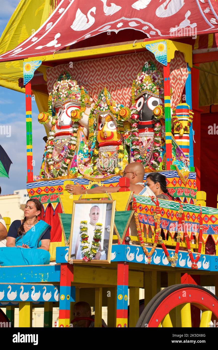 The annual Rathayatra Festival for Lord Krishna and his devotees promenades along Hove esplanade each year. Krishna in his form of Jagannatha is pulled along on a large wooden juggernaut. Stock Photo