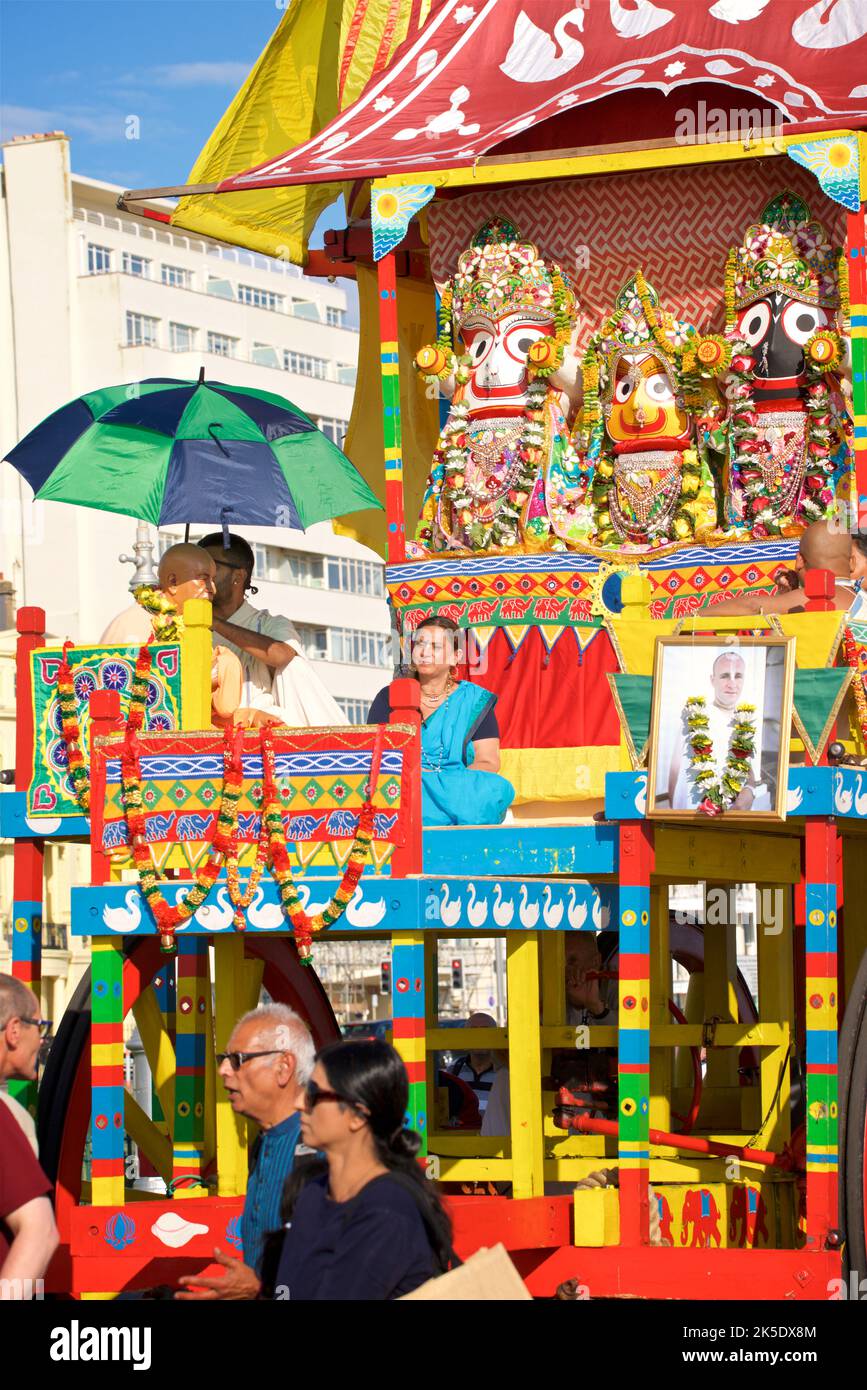 The annual Rathayatra Festival for Lord Krishna and his devotees promenades along Hove esplanade each year. Krishna in his form of Jagannatha is pulled along on a large wooden juggernaut. Stock Photo