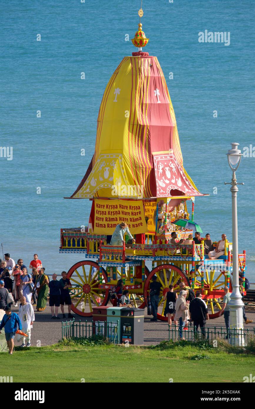 The Hare Krishna procession juggernaut,The annual Rathayatra Festival for Lord Krishna and his devotees promenades along Hove esplanade each year. Krishna in his form of Jagannatha is pulled along on a large wooden juggernaut. Stock Photo