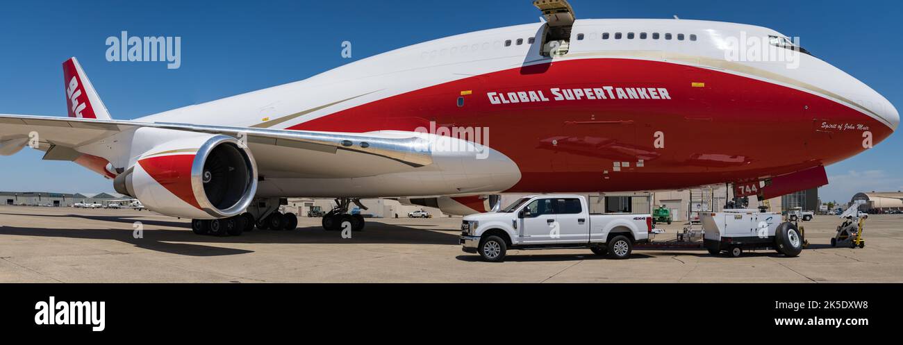 Wide angle perspective of the 'Spirit of John Muir', the World's largest aerial fire fighting asset, here being used along with the Bureau of Land Management to combat wildfires in remote areas of California. The 747 Supertanker was one of several aerial firefighting airtankers derived from various Boeing 747 models. The aircraft were rated to carry up to 19600 US gallons of fire retardant or water. In 2021, Global SuperTanker Services shut down, selling the Supertanker to National Airlines to be converted into a cargo aircraft. Credit: BLM/ J.Pluim Stock Photo