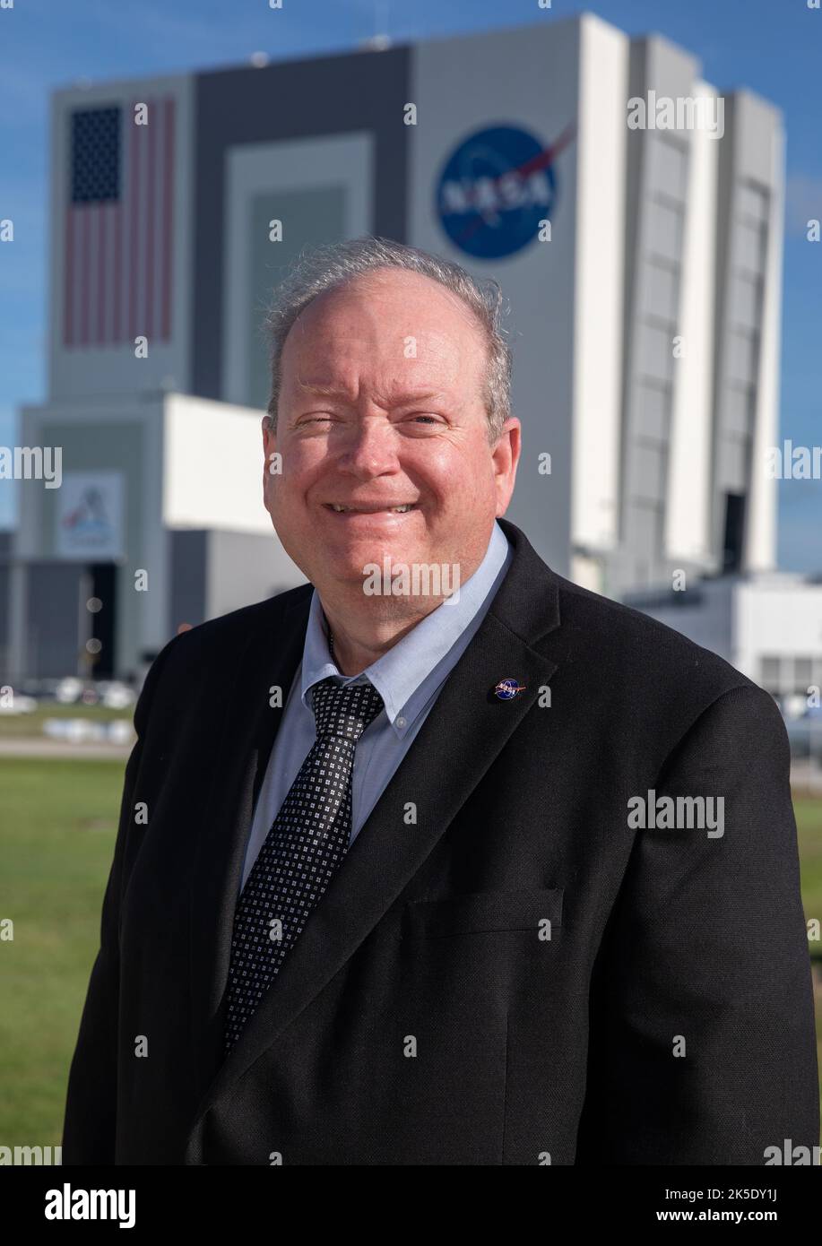 NASA Kennedy Space Center’s Associate Director of Management Burt Summerfield is shown with the Florida spaceport’s Vehicle Assembly Building in the background on June 29, 2022. Summerfield, who began his career at the center in 1982, is responsible for management of Kennedy’s Center Management and Operations (CMO) budget. His duties include executing the center’s strategic analysis, planning, business development, and communications capability that guide key center decisions and relationships. Stock Photo