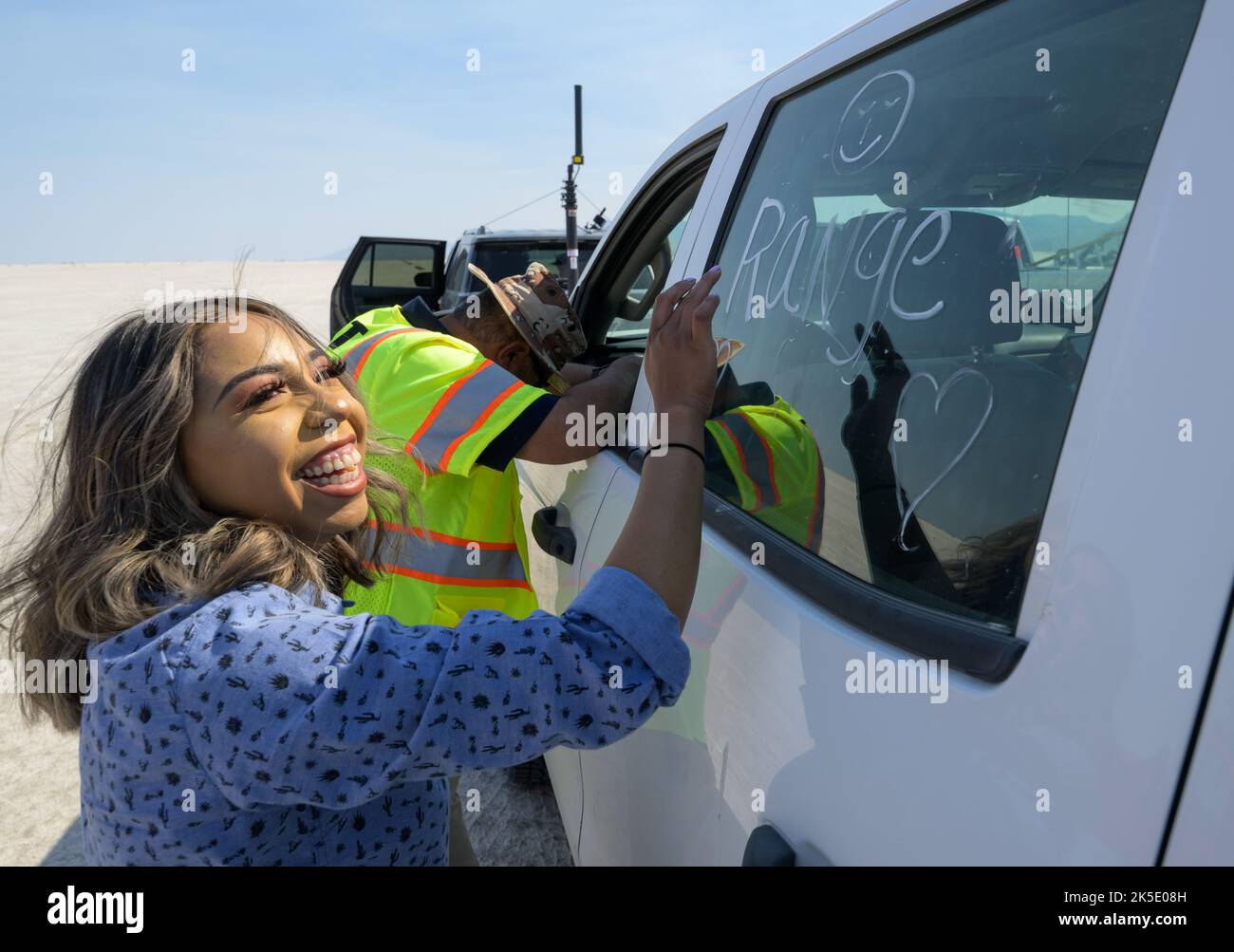 A member of the range safety team labels her convoy vehicle as they