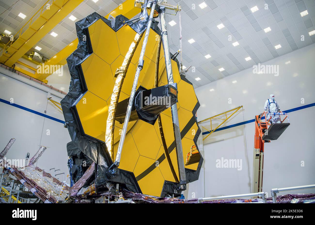 James Webb Space Telescope (JWST)'s Full Mirror Deployment Test. Webb has the largest mirror of its kind that NASA has ever built. In March 2020, testing teams deployed Webb's 21'4' (6.5m) primary mirror into the same configuration it will have when in space.Like the art of origami, Webb is a collection of movable parts that have been specifically designed to fold to a compact formation that is considerably smaller than when the observatory is fully deployed. An optimised version of a NASA image by experienced lead photographer Chris Gunn. Credit: NASA/Chris Gunn. For editorial use only Stock Photo