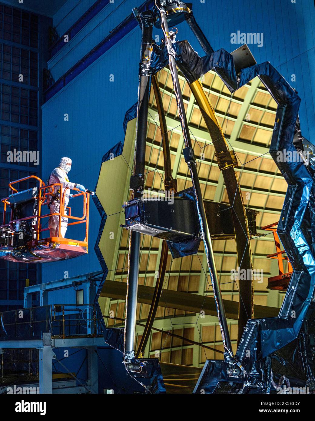 Preparing the James Webb Space Telescope (JWST). This image was captured after the successful 'center of curvature' testing operations. The technician with the flashlight is George Mooney.  An optimised version of a NASA image by experienced lead photographer Chris Gunn. Credit: NASA/Chris Gunn. For editorial use only. Stock Photo