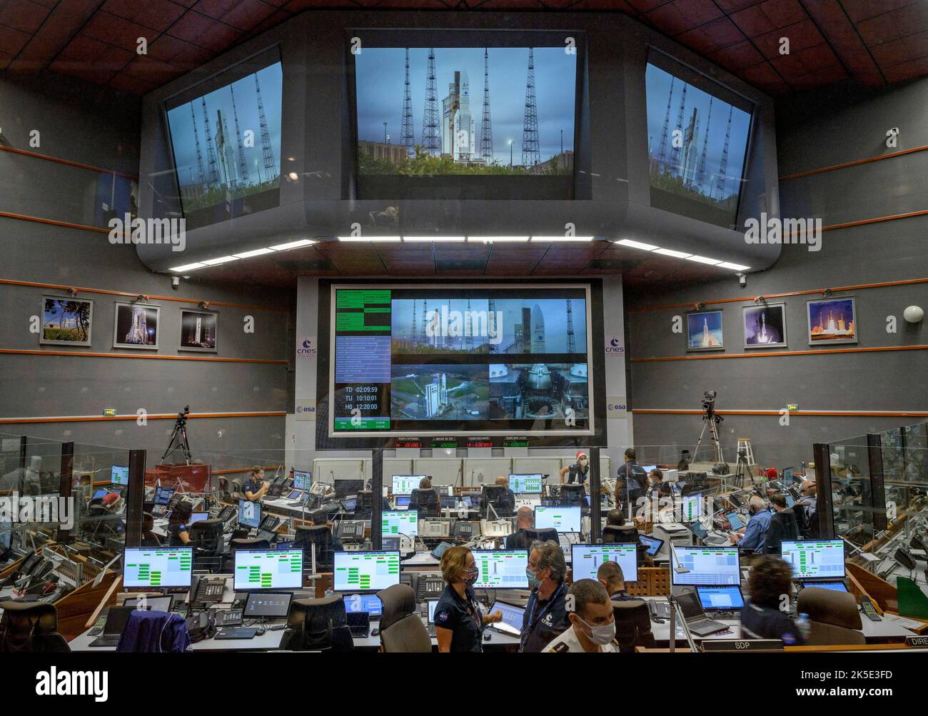 Launch teams monitor the countdown to the launch of the Ariane 5 rocket carrying the James Webb Space Telescope, 25 December 2021, in the Jupiter Center at the Guiana Space Center in Kourou, French Guiana. The James Webb Space Telescope (sometimes called JWST or Webb) is a large infrared telescope with a 21.3 foot (6.5 meter) primary mirror. The observatory will study every phase of cosmic history - from within our solar system to the most distant observable galaxies in the early universe. Image by senior NASA photographer Bill Ingalls / Credit B.Ingalls/NASA. Editorial Use only Stock Photo