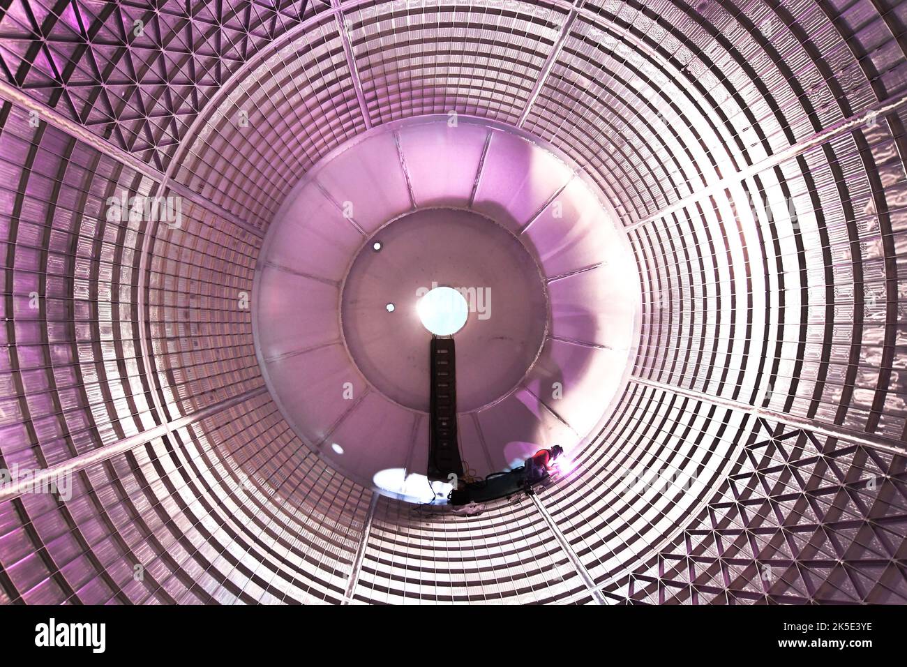 Liquid Oxygen Tank Flight Undergoing First Space Launch System (SLS) Hydrostatic Test. The liquid oxygen tank-shown here as technicians inside the tank complete final welds to plug holes left by the robotic welder- is undergoing the first hydrostatic testing for NASA's deep-space rocket, the SLS. The tank is filled with around 200,000 gallons of water that will simulate the propellant, loads, pressure and mass of the liquid oxygen. This test ensures that welds will hold to the right strength when exposed to forces similar to those experienced during launch and flight.  Credit: NASA/JGuidry Stock Photo