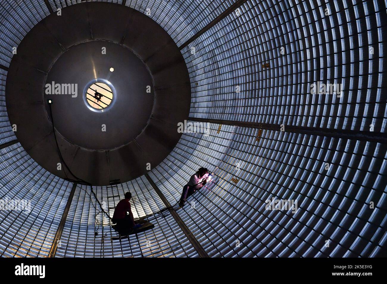 Plugging Away Inside Massive SLS Fuel Tank: Welders inside a large liquid hydrogen tank for NASA's Space Launch System at the Michoud Assembly Facility in New Orleans are plugging holes left after the tank was assembled. Using frictional heating and forging pressure, friction stir welding produces high-strength bonds virtually free of defects. SLS - the most powerful rocket in the world - along with NASA's Orion spacecraft will send astronauts deeper into space than ever before, including on the agency's journey to Mars.  An optimised version of a NASA image. Credit: NASA Stock Photo