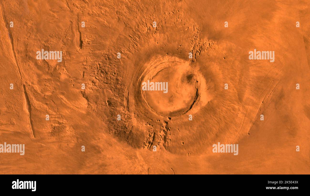 Mars' Tharsis plateau showing the extinct volcano Arsia Mons. Assembled from images taken by Viking 1 Orbiter during its 1976-1980 working life at Mars. Measuring about 68 miles (110km) across, the caldera is deep enough to hold the more than the entire volume of water in Lake Huron. NASA research reveals that the last volcanic activity there ceased about 50 million years agoÑaround the time of Earth's CretaceousÐPaleogene extinction, when large numbers of our planet's plant species and dinosaurs went extinct. An optimised version of a NASA image. Credit: NASA/JPL/USGS Stock Photo