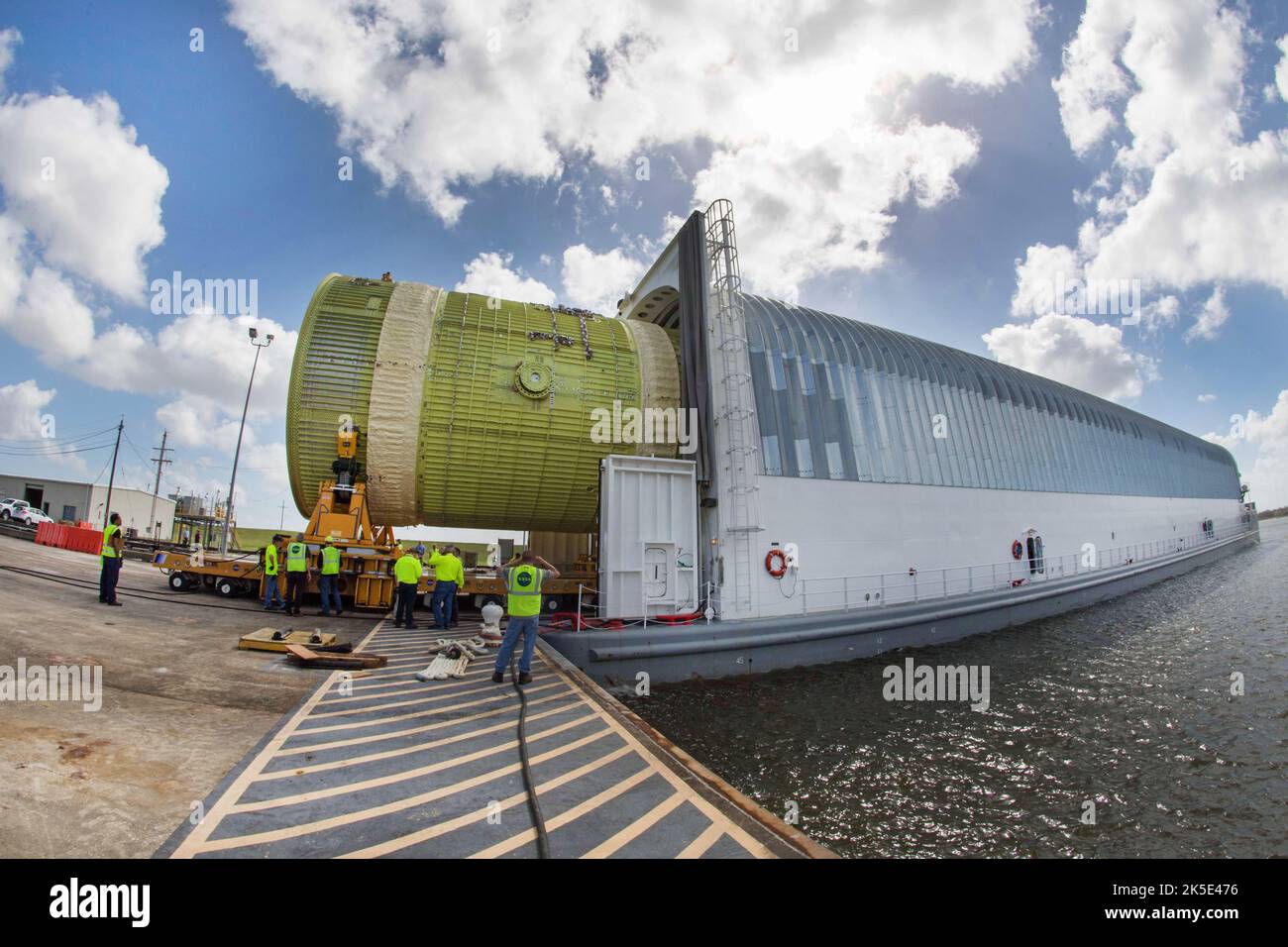 A structural test version of the intertank for NASA's new heavy-lift rocket, the Space Launch System (SLS), is loaded onto the 310-ft Pegasus barge, 22 February 2018, at NASA's Michoud Assembly Facility in New Orleans. The intertank is the second piece of structural hardware for the rocket's massive core stage scheduled for delivery to NASA's Marshall Space Flight Center in Huntsville, Alabama, for testing will stress-test the intertank with millions of pounds of force to simulate the forces of launch and ascent. An optimised version of an original NASA image. Credit: NASA Stock Photo