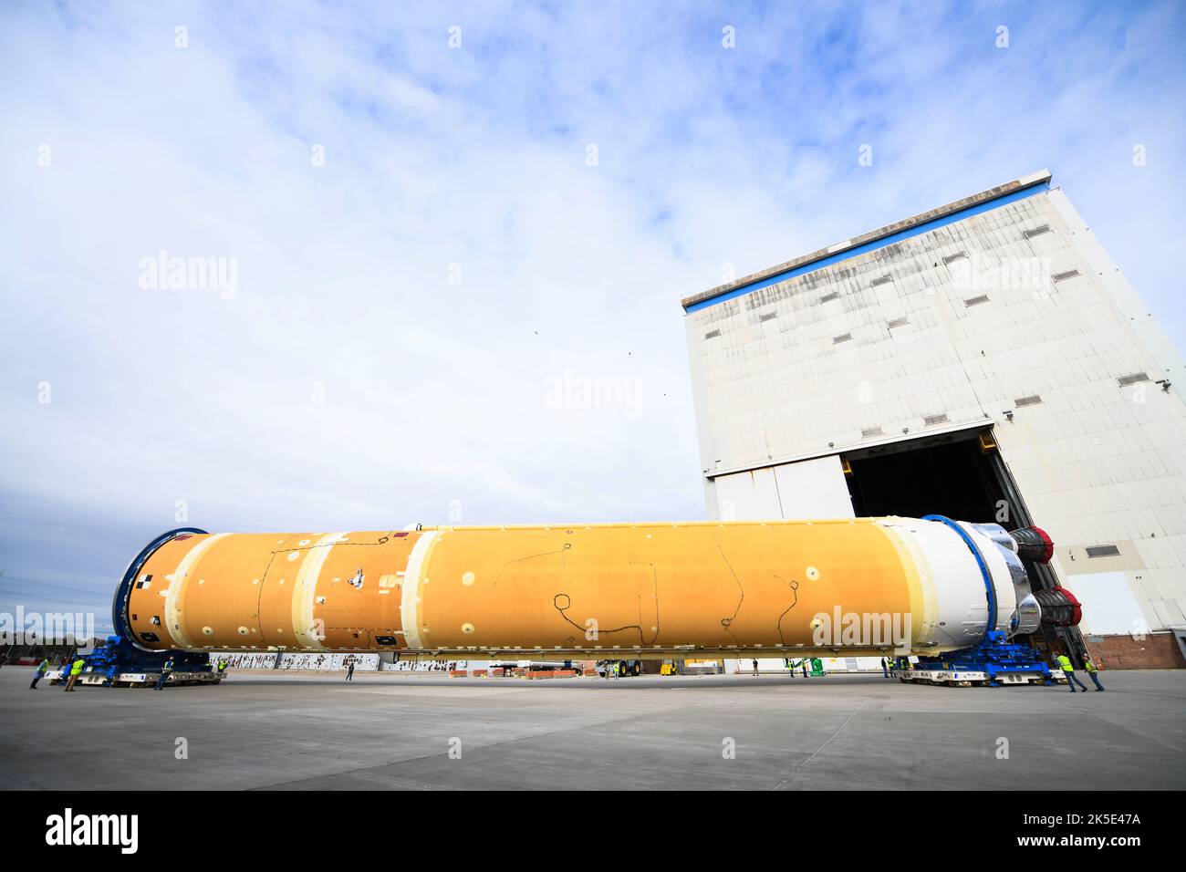 Teams at NASA's Michoud Assembly Facility in New Orleans moved the core stage, complete with all four RS-25 engines, for NASA's Space Launch System (SLS) rocket to Building 110 for final shipping preparations on 1 January 2020. The SLS core stage includes state-of-the-art avionics, propulsion systems and two colossal propellant tanks that collectively hold 733,000 gallons of liquid oxygen and liquid hydrogen to power its four RS-25 engines. The completed stage help power the first Artemis mission to the Moon An optimised version of an original NASA image. Credit: NASA/JGuidry Stock Photo