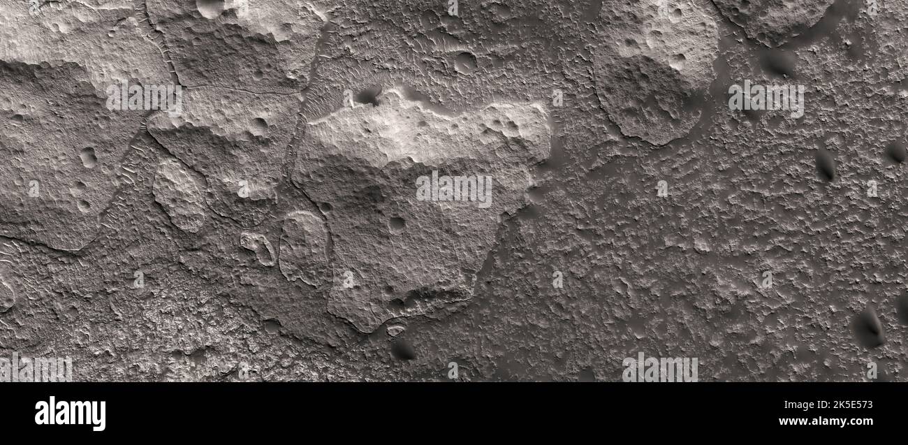 Martian landscape. This HiRISE image shows landforms on the surface of Mars. Floor of a Degraded Crater in Terra Cimmeria Terra Cimmeria is one part of the heavily cratered, southern highland region of the planet. The Spirit rover landed near the area. The word 'Cimmerium' comes from an ancient Thracian seafaring people. (256 km above the surface, less than 5 km top to bottom and north is to the right.) A unique optimised version of NASA imagery. Credit: NASA/JPL/UArizona Stock Photo