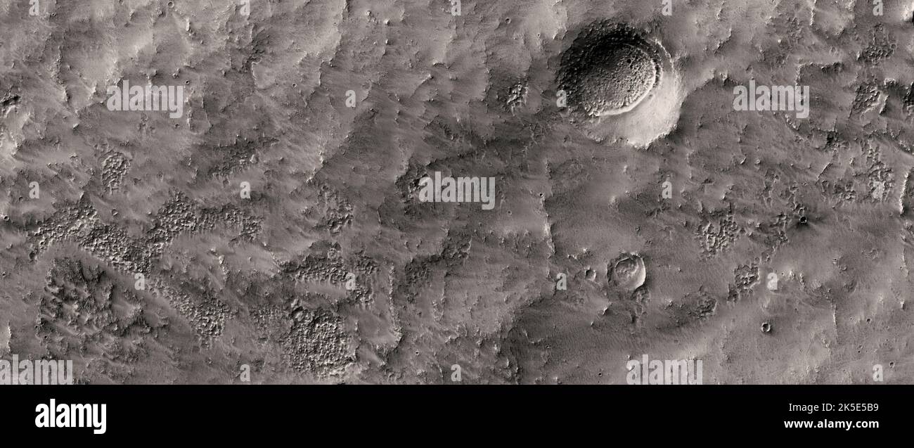 Martian landscape. This HiRISE image shows landforms on the surface of Mars. Sample of the terrain in the Southern Mid-Latitudes This area may contain ice table-related morphologies. Image taken from 251 km above the surface; terrain shown less than 5 km across. A unique optimised version of NASA imagery. Credit: NASA/JPL/UArizona Stock Photo