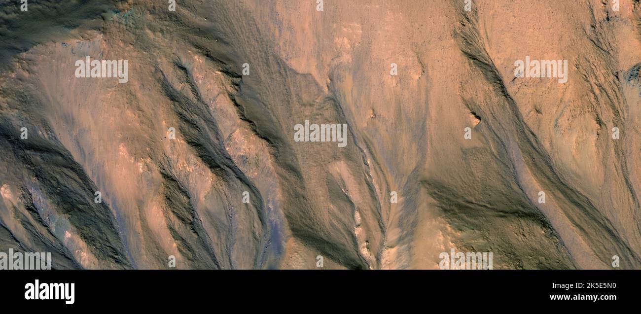 Martian landscape. This HiRISE image shows landforms on the surface of Mars. Gullies in Southern Hemisphere Crater. Less than 1 km top to bottom and north is to the left.) A unique optimised version of NASA imagery. Credit: NASA/JPL/UArizona Stock Photo
