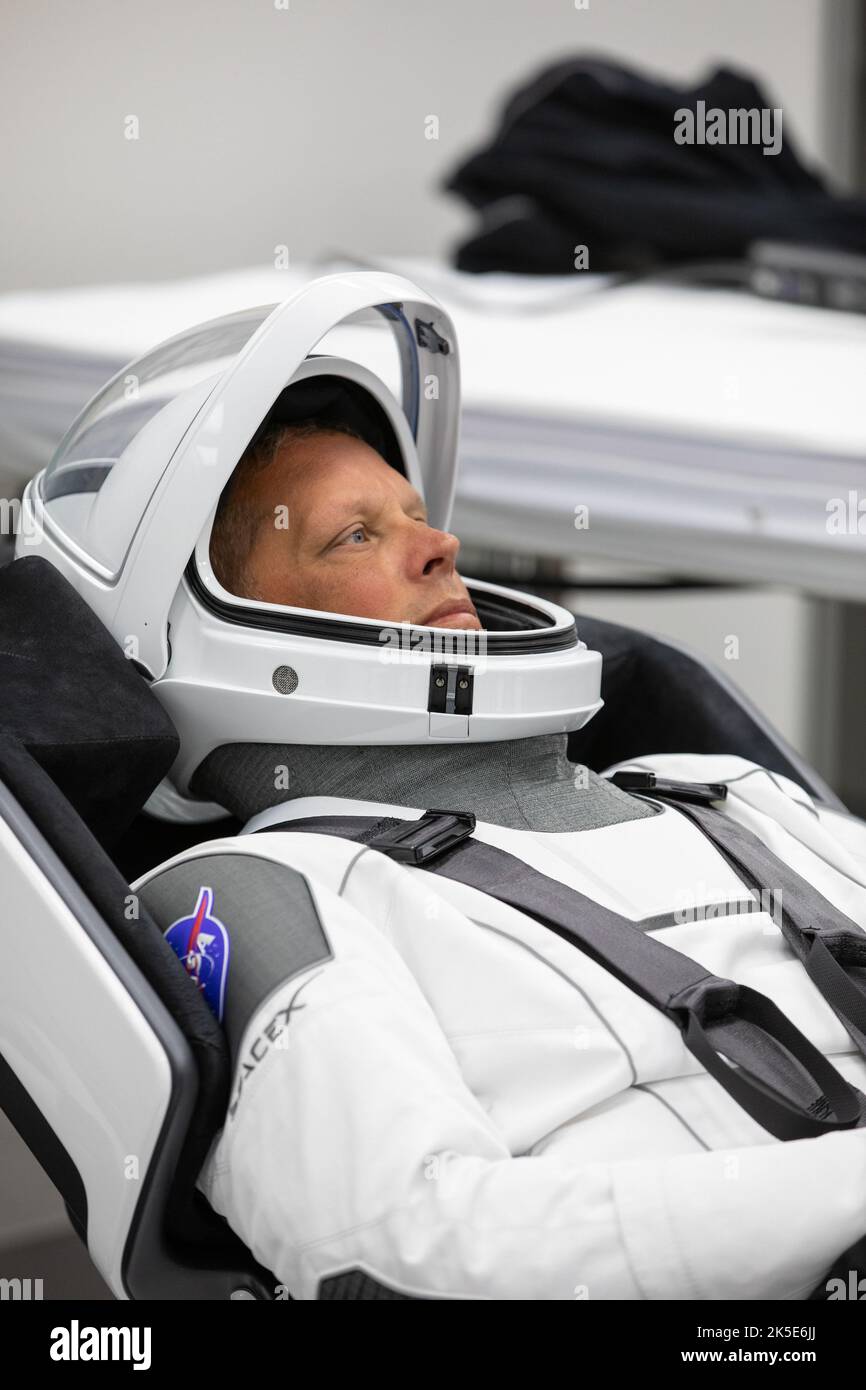 Crew-4 mission astronaut Bob Hines relaxes in the suit room in the Astronaut Crew Quarters inside Kennedy Space Center’s Neil A. Armstrong Operations and Checkout Building on April 27, 2022. A team of SpaceX suit technicians assisted the crew as they put on their custom-fitted spacesuits and checked the suits for leaks. Hines, along with Samantha Cristoforetti, Kjell Lindgren, and Jessica Watkins, will launch aboard SpaceX’s Crew Dragon, powered by the company’s Falcon 9 rocket, to the International Space Station as part of NASA’s Commercial Crew Program. Crew-4 is scheduled to lift off today Stock Photo