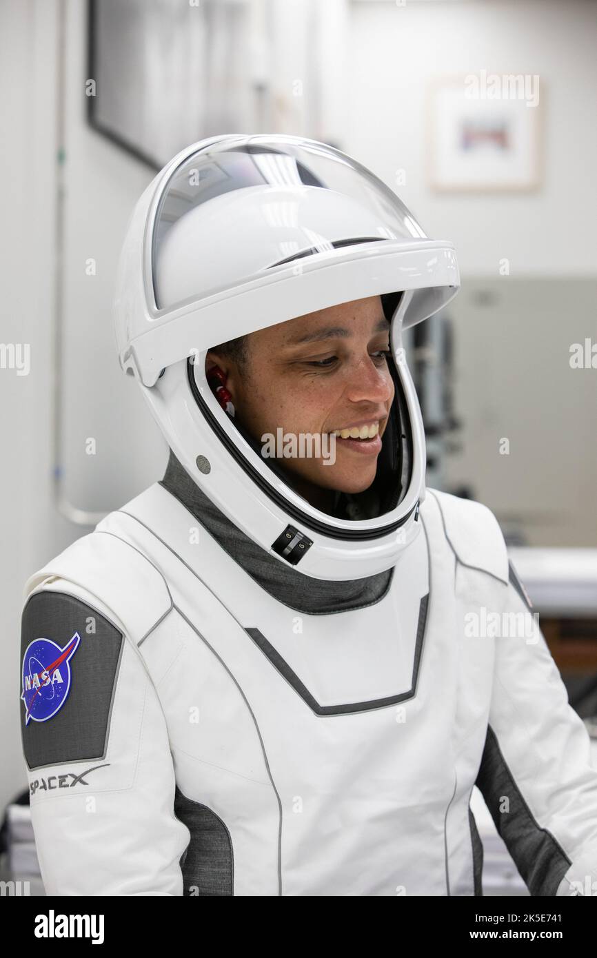 Crew-4 mission astronaut Jessica Watkins smiles in the suit room in the Astronaut Crew Quarters inside Kennedy Space Center’s Neil A. Armstrong Operations and Checkout Building on April 27, 2022. A team of SpaceX suit technicians assisted Watkins, along with Crew-4 members Kjell Lindgren, Bob Hines, and Samantha Cristoforetti, as they put on their custom-fitted spacesuits and checked the suits for leaks. The four astronauts will launch aboard SpaceX’s Crew Dragon, powered by the company’s Falcon 9 rocket, to the International Space Station as part of NASA’s Commercial Crew Program. Crew-4 is s Stock Photo