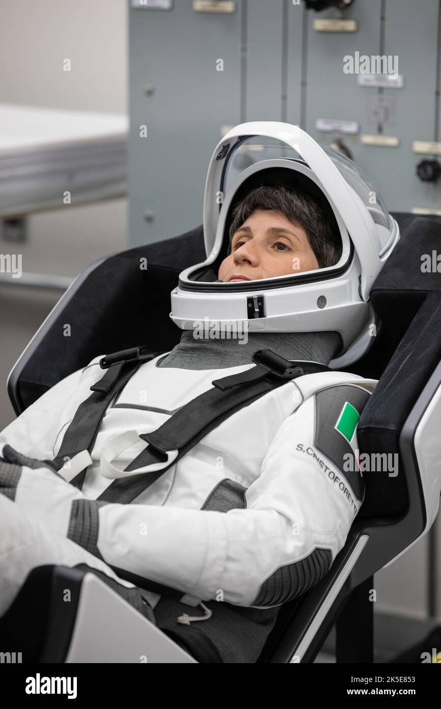 Crew-4 mission astronaut Samantha Cristoforetti relaxes in the suit room in the Astronaut Crew Quarters inside Kennedy Space Center’s Neil A. Armstrong Operations and Checkout Building on April 27, 2022. A team of SpaceX suit technicians assisted the crew as they put on their custom-fitted spacesuits and checked the suits for leaks. Cristoforetti, along with Bob Hines, Kjell Lindgren, and Jessica Watkins, will launch aboard SpaceX’s Crew Dragon, powered by the company’s Falcon 9 rocket, to the International Space Station as part of NASA’s Commercial Crew Program. Crew-4 is scheduled to lift of Stock Photo