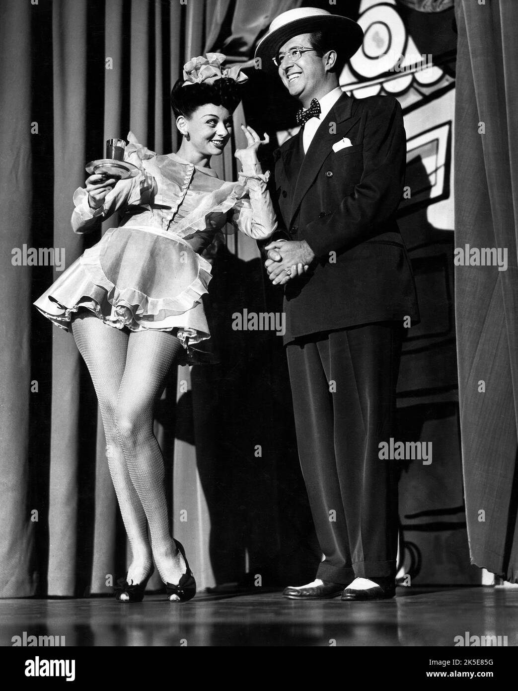 Virginia Wilson, Phil Silvers, on-set of the Film, 'Cover Girl', Columbia Pictures, 1944 Stock Photo