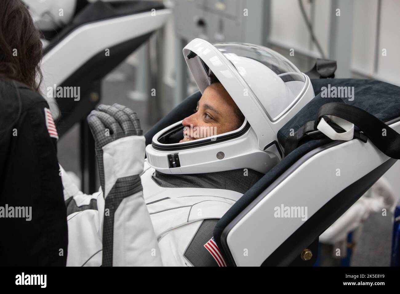 Crew-4 mission astronaut Jessica Watkins relaxes in the suit room in the Astronaut Crew Quarters inside Kennedy Space Center’s Neil A. Armstrong Operations and Checkout Building on April 27, 2022. A team of SpaceX suit technicians assisted the crew as they put on their custom-fitted spacesuits and checked the suits for leaks. Watkins, along with Bob Hines, Kjell Lindgren, and Samantha Cristoforetti, will launch aboard SpaceX’s Crew Dragon, powered by the company’s Falcon 9 rocket, to the International Space Station as part of NASA’s Commercial Crew Program. Crew-4 is scheduled to lift off toda Stock Photo