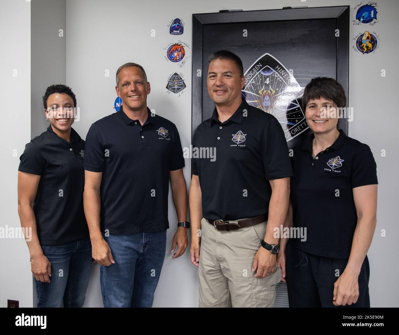 From left, Crew-4 mission astronauts Jessica Watkins, Bob Hines, Kjell Lindgren, and Samantha Cristoforetti, pose in the Astronaut Crew Quarters inside Kennedy Space Center’s Neil A. Armstrong Operations and Checkout Building on April 27, 2022. The four astronauts will launch aboard SpaceX’s Crew Dragon – powered by the company’s Falcon 9 rocket – to the International Space Station as part of NASA’s Commercial Crew Program. They are scheduled to lift off today at 3:52 a.m. EDT from Launch Complex 39A at Kennedy. Stock Photo